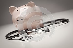 Piggy Bank and Stethoscope with Selective Focus