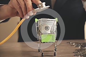 Piggy bank with stethoscope, tax offset concept,