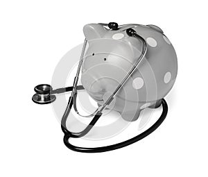 Piggy bank with stethoscope on white background. Medical insurance