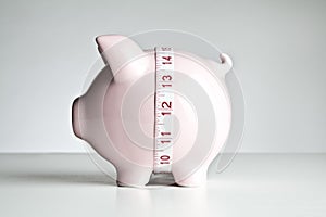 Piggy bank and tape measure