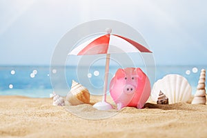 Piggy Bank Under The Parasol At Beach