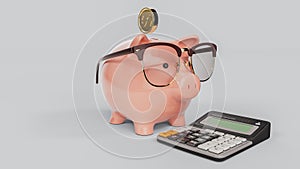 Piggy bank wearing glasses looking at a calculator Waiting to calculate the accumulated money