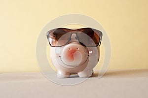 Piggy bank wearing retro sunglasses cutout photo