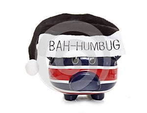 Piggy bank wearing a scrouge bah humbug hat