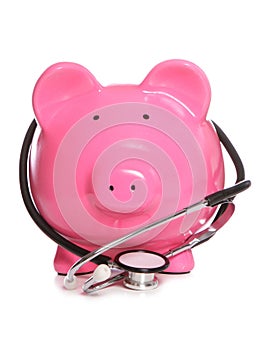 Piggy bank wearing stethoscope