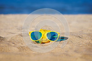 Piggy bank wearing sunglasses on summer vacation