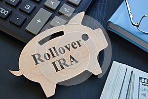 Piggy bank and words rollover IRA on it.