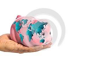 Piggy bank with worldmap in male hand isolated on white