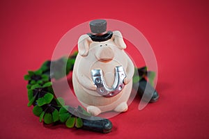 Piggy with horseshoes for New Year`s Eve