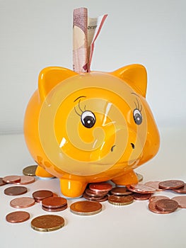 Piggy money bank with coins
