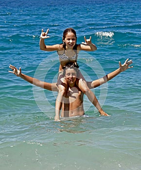 Piggyback (brother and sister) on sea