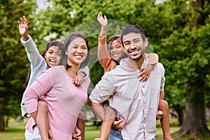 Piggyback, portrait and happy asian family in a park with love, smile and games in nature. Face, freedom and parents