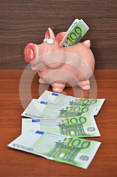 Piggybank with euro notes