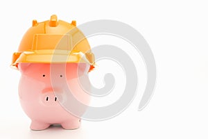 Piggybank with hard hat photo