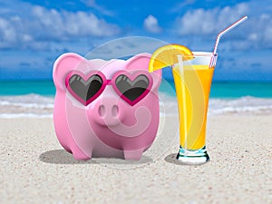 Piggybank with sunglasses on the beach photo