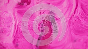 Pigment swirls paint flow pink ink fluid stream