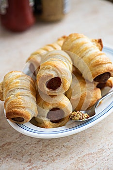 Pigs in a blanket - mini sausage roll on a plate