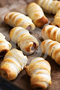 Pigs in a blanket - puff pastry baking with sausages