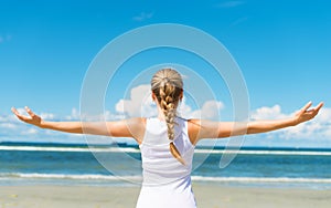 Pigtailed girl on the beach.