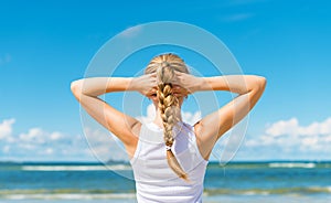 Pigtailed girl on the beach.