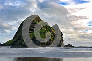 Piha beach, a popular black sand beach for recreational activities in New Zealand