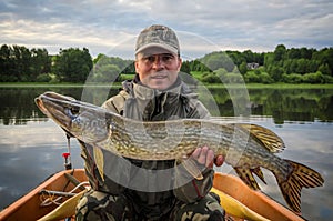 Pike fishing in summer Scandinavian lake