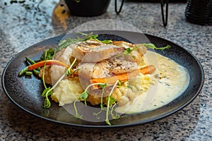 Pikeperch zander fillet plate served at a restaurant gourmet food photo