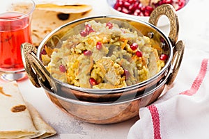 Pilaf with meat, spices and pomegranate seeds. Traditional dish of Asian cuisine