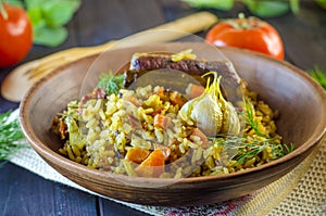 Pilaf on a platter with meat and spices