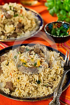 Pilaf style rice and lamb with carrots and garlic