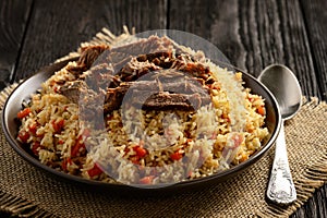 Pilaf- traditional asian dish, rice prepared with vegetables and meat.