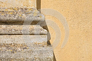 Pilaster strip of an old neoclassic Italian church against a plaster wall photo