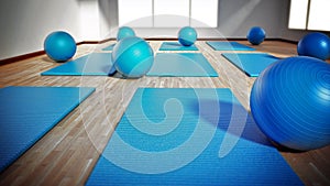 Pilates mat and exercise balls standing on parquet floor. 3D illustration