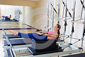 Pilates reformer woman back stroke exercise