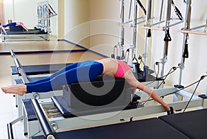 Pilates reformer woman back stroke exercise