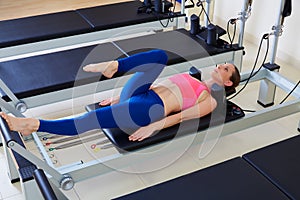 Pilates reformer woman foot work exercise