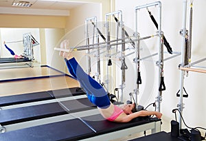 Pilates reformer woman long spine exercise