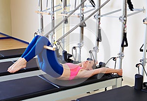 Pilates reformer woman short spine exercise