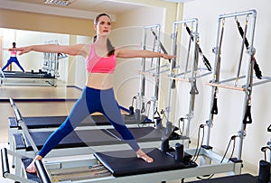 Pilates reformer woman side split exercise photo