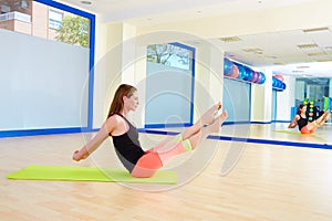 Pilates woman boomerang exercise workout at gym