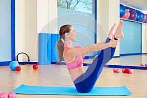 Pilates woman open leg rocker exercise workout