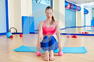 Pilates woman sand balls exercise workout at gym