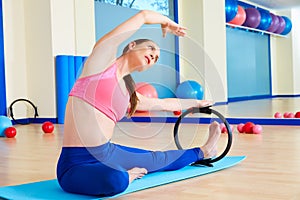 Pilates woman side stretch magic ring exercise