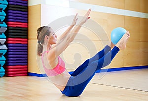 Pilates woman stability ball teaser exercise