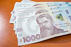 Pile of 1000 banknotes ukrainian money as financial background. UAH. Money and save concept