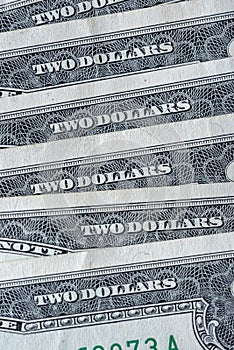 pile of 2 US dollars bills, finance concept