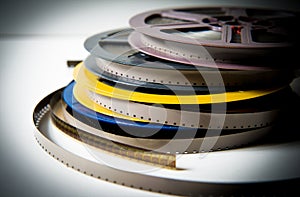 Pile of 8mm super8 movie reels with color effect and out of focus background