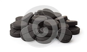 Pile of activated charcoal pills