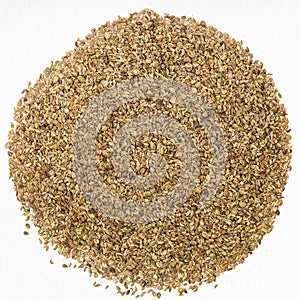 Pile of Ajwain seeds on gray ceramic plate