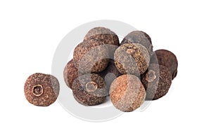 Pile of allspice isolated on white background. Jamaica pepper, allspice peppercorns or myrtle pepper.